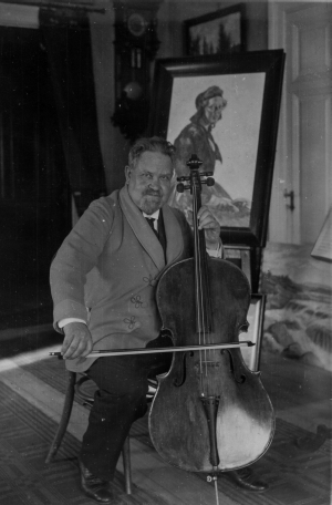 Karl Tirén med sin cello och den kopia han själv målat efter Anders Zorns målning ”Flodakullan”
