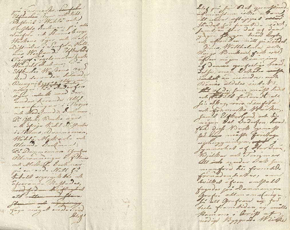 Uppslag från äldre skrivbok med handskriven text. 